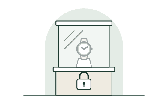 A watch in a closed glass case with a lock at its base